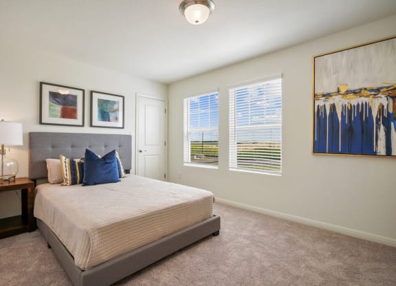 Maple bedroom with a bed and two windows at Beacon at Ashley River Landing in Summerville, SC