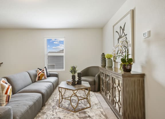 loft living room with a grey couch and modern decorations