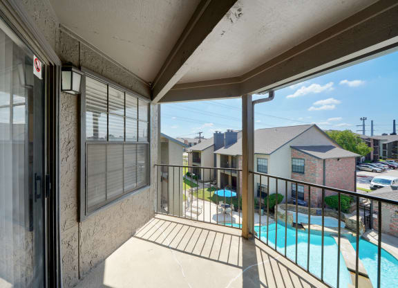Balcony with Pool View at Polaris Apartment Homes in Irving, Texas, TX