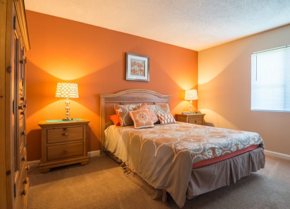 a bedroom with a bed and two night stands at Dunwoody Pointe in Sandy Springs, GA