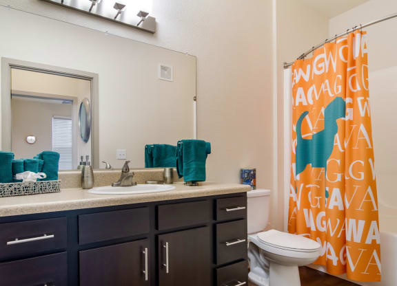 Bathroom with a large mirror at Oakleaf Plantation in Jacksonville, FL