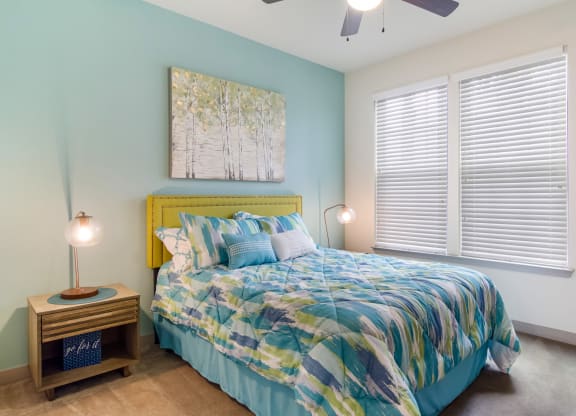 Bedroom with a big window at Oakleaf Plantation in Jacksonville, FL