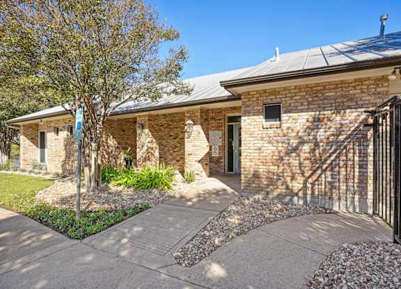 Exterior of the leasing office entry at On the Green apartments in Austin, TX