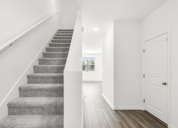 a bedroom with a staircase in a 555 waverly unit