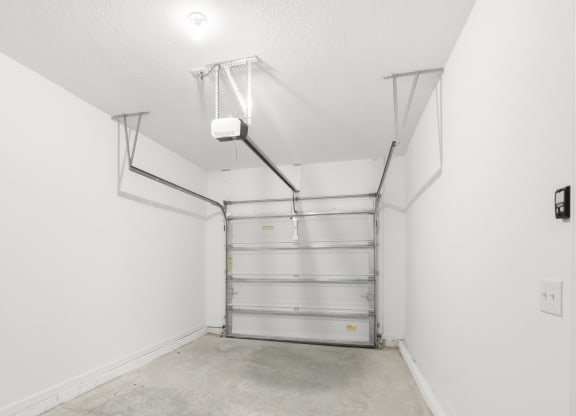 spacious garage with white walls and bright light