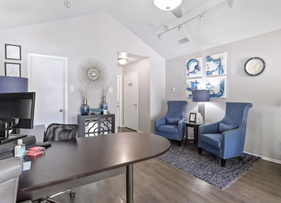 a living room with a table and chairs