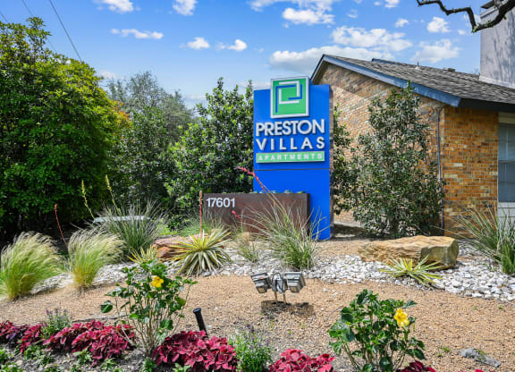 a picture of the front of the building with a sign in front of it