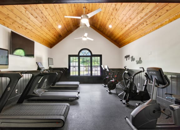 a gym with treadmills and elliptical machines at Grand Reserve at Columbus Apartments in Columbus, Georgia, GA