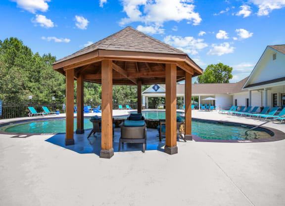 a gazebo with a grill next to a pool at Grand Reserve at Columbus Apartments in Columbus, Georgia, GA