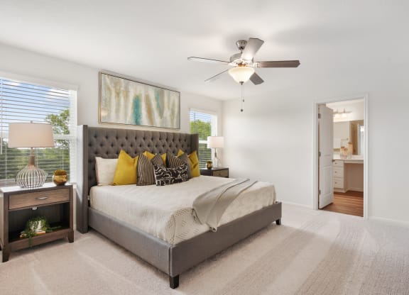 Large master bedroom with ceiling fan in Redbud floor plan at Beacon at Ashley River Landing in Summerville, SC