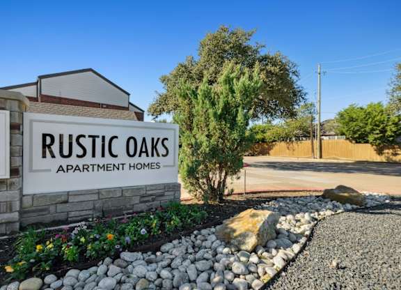 Rustic Oaks Apartments in Wylie, Tx property sign