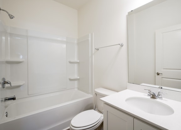 a bathroom with a sink toilet and a bath tub
