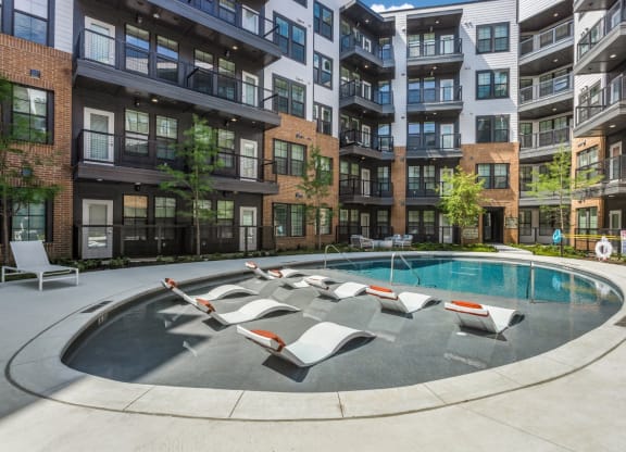 Sunbathing Area by the Pool at St. Elmo Apartment in Austin, TX