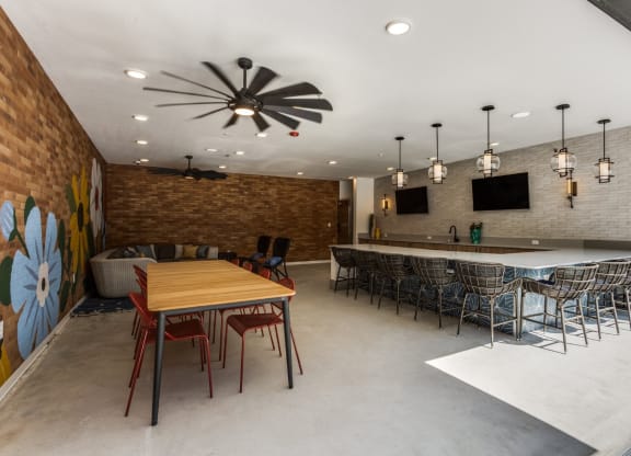 resident center with screens on the wall at St. Elmo Apartment in Austin, TX