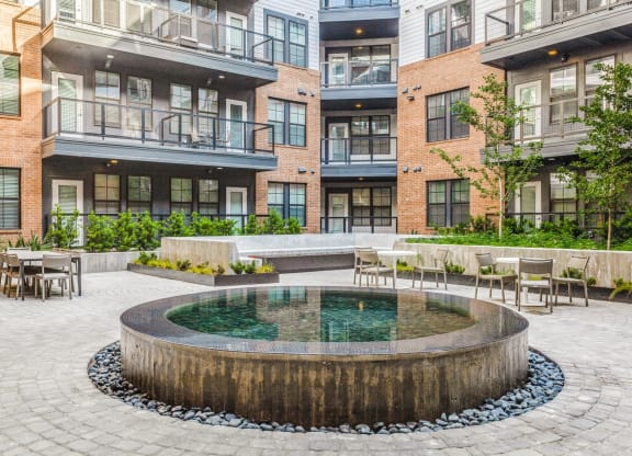 Tranquil Water Fountain Feature for Serene Ambiance at St. Elmo Apartment in Austin, TX