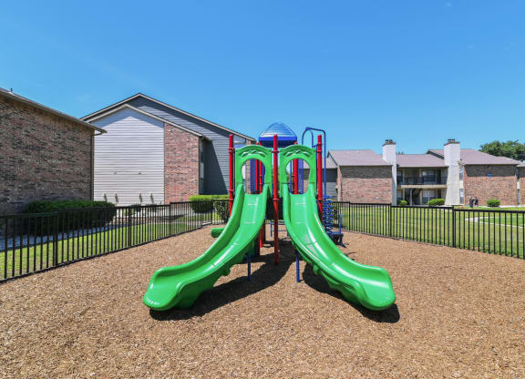 a playground at the whispering winds apartments in pearland, tx