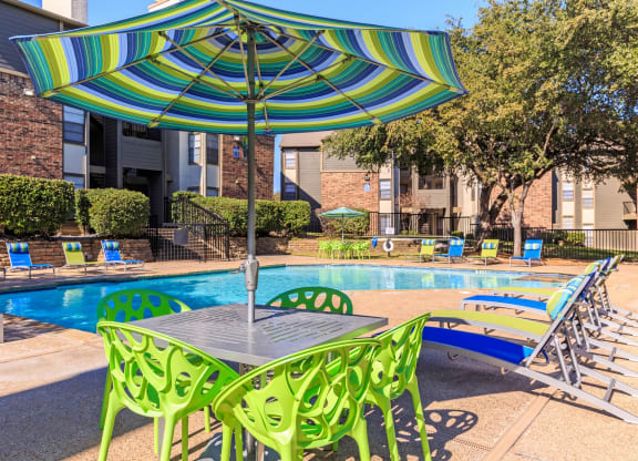 Outdoor table area  at The Summit Apartments in Mesquite, Texas, TX