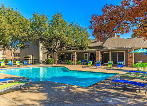 Outdoor swimming pool  at The Summit Apartments in Mesquite, Texas, TX