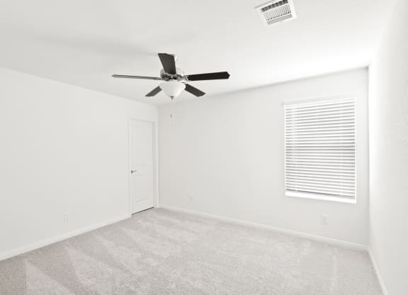 Sycamore spacious bedroom with ceiling fan and natural lighting at Beacon at Ashley River Landing in Summerville, SC