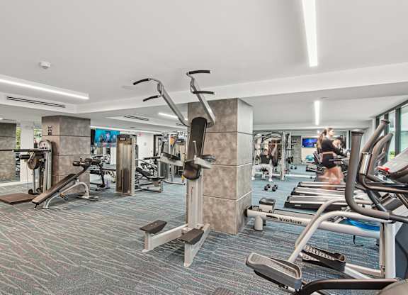 Fitness center with a variety of strength and cardio equipment at Twenty2 West luxury apartments in Miami, FL