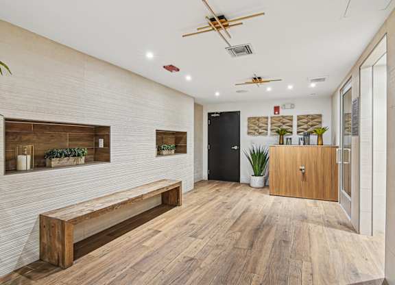 Seating area in sauna with a bench at Twenty2 West luxury apartments in Miami, FL