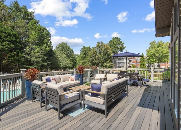 Clubhouse upstairs patio with couches and chairs at Wellington Ridge in Lawrenceville, GA