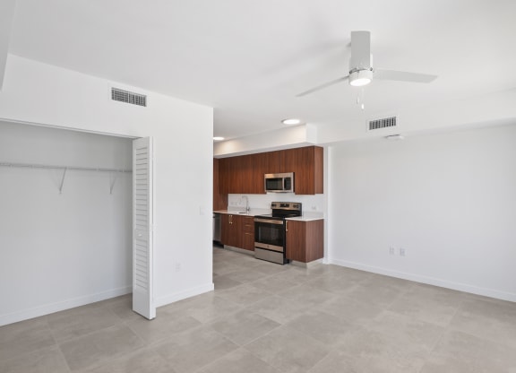 an open living space with kitchen and a loset at Westgate on University in Lauderhil, Fl
