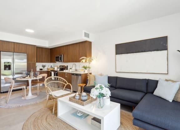Living Room in A1 Floor Plan with L-Shaped Couch at Westgate on University in Lauderhill, FL