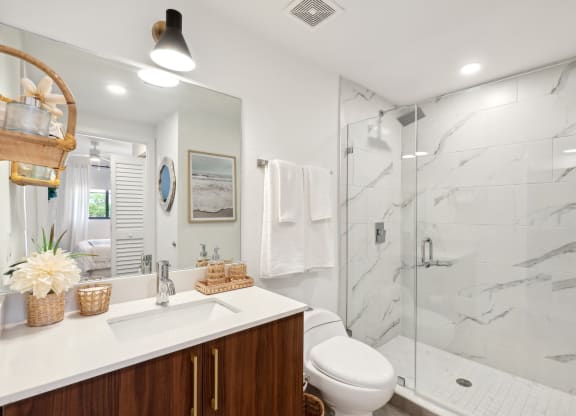 Bathroom with walk-in shower in B1 Floor Plan at Westgate on University in Lauderhill, FL