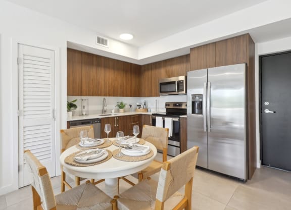 Kitchen in B1 Floor Plan with dining table at Westgate on University in Lauderhill, FL