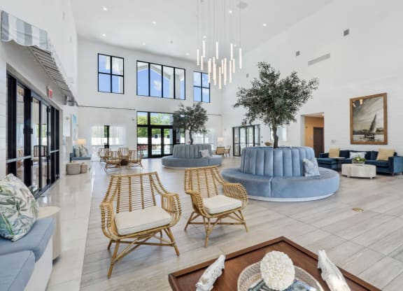 Clubhouse with beautiful trees and seating at Westgate on University in Lauderhill, FL