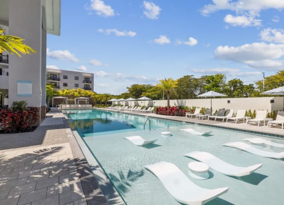 Resort-Inspired Pool with Cabanas and In-Pool Seating at Westgate on University in Lauderhill, FL