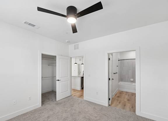 B2 bedroom with a ceiling fan at Whispering Pines at Westdale Hills in Euless, TX