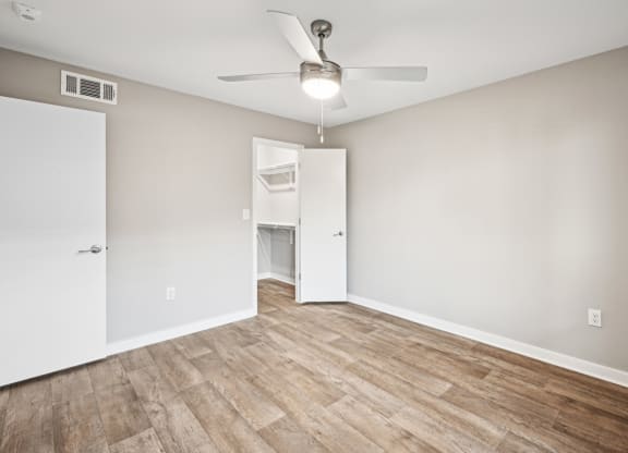 Serene bedroom area in the D5 floor plan at Windridge On The Parkway Apartments in Dallas, TX