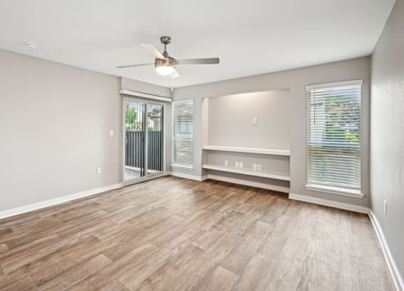 Bright and inviting living room area in the D5 floor plan at Windridge On The Parkway Apartments in Dallas, TX