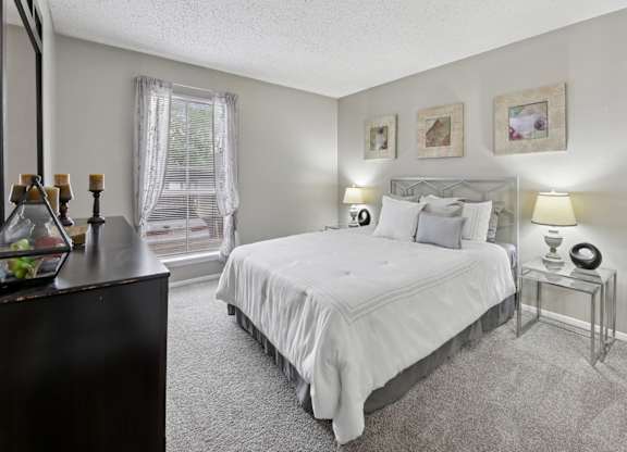 B1 second bedroom with white bed at Westdale Pointe in Austin, TX
