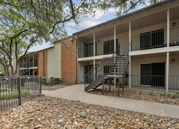 Apartment entrances with stairway at Westdale Pointe in Austin, TX