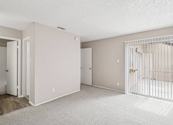 B6 room with a white carpet and a white gate.