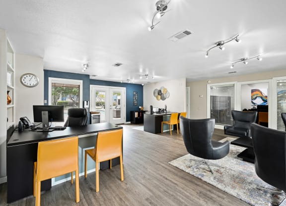 Interior of leasing office with a lot of comfortable seating at Windridge in Dallas, TX