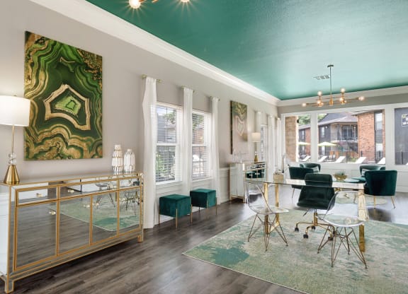 a living room with a green ceiling and white walls