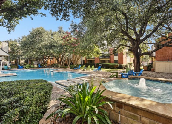 Swimming pool with a fountain at Hunters Chase in Austin, TX