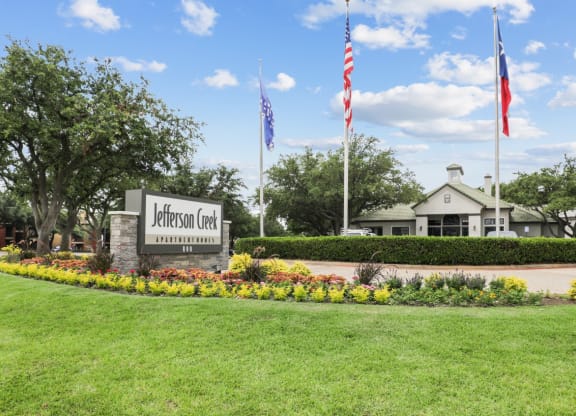 the view of the welcome sign at Jefferson Creek in Irving, TX
