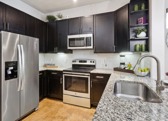 a kitchen at Muse at Museum District, Houston, TX