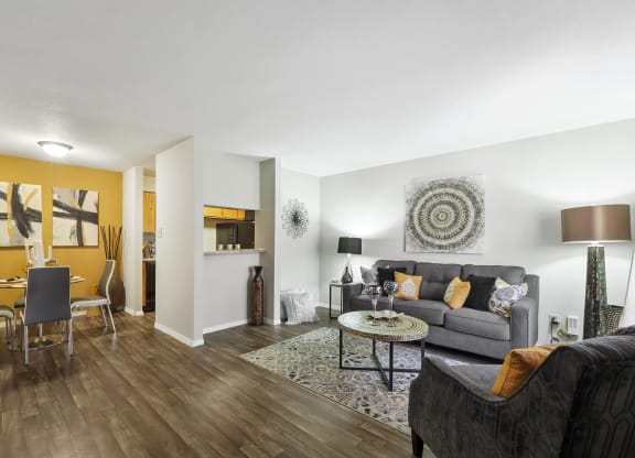 a living room with a yellow accent wall