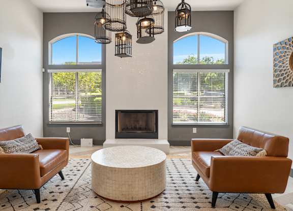Cozy seating area with fireplace and birdcage pendant lights at Radius at the Domain Apartments, Texas, 78758