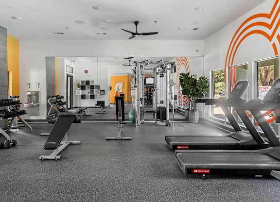 Gym with treadmills and cable machine equipment at Radius at the Domain Apartments, Austin, Texas