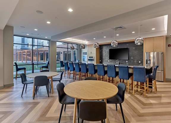 A conference room with a long table and chairs.