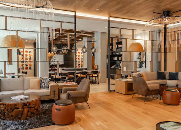 A modern living room with a wooden floor and furniture.