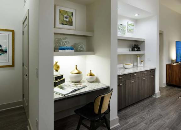 A modern kitchen with a dining table and chairs.