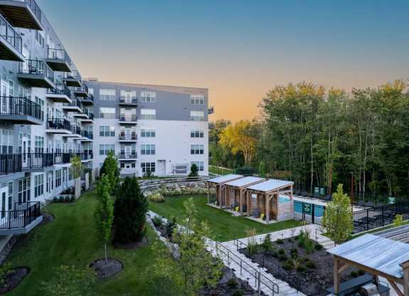 A modern apartment complex with a well-maintained outdoor area.